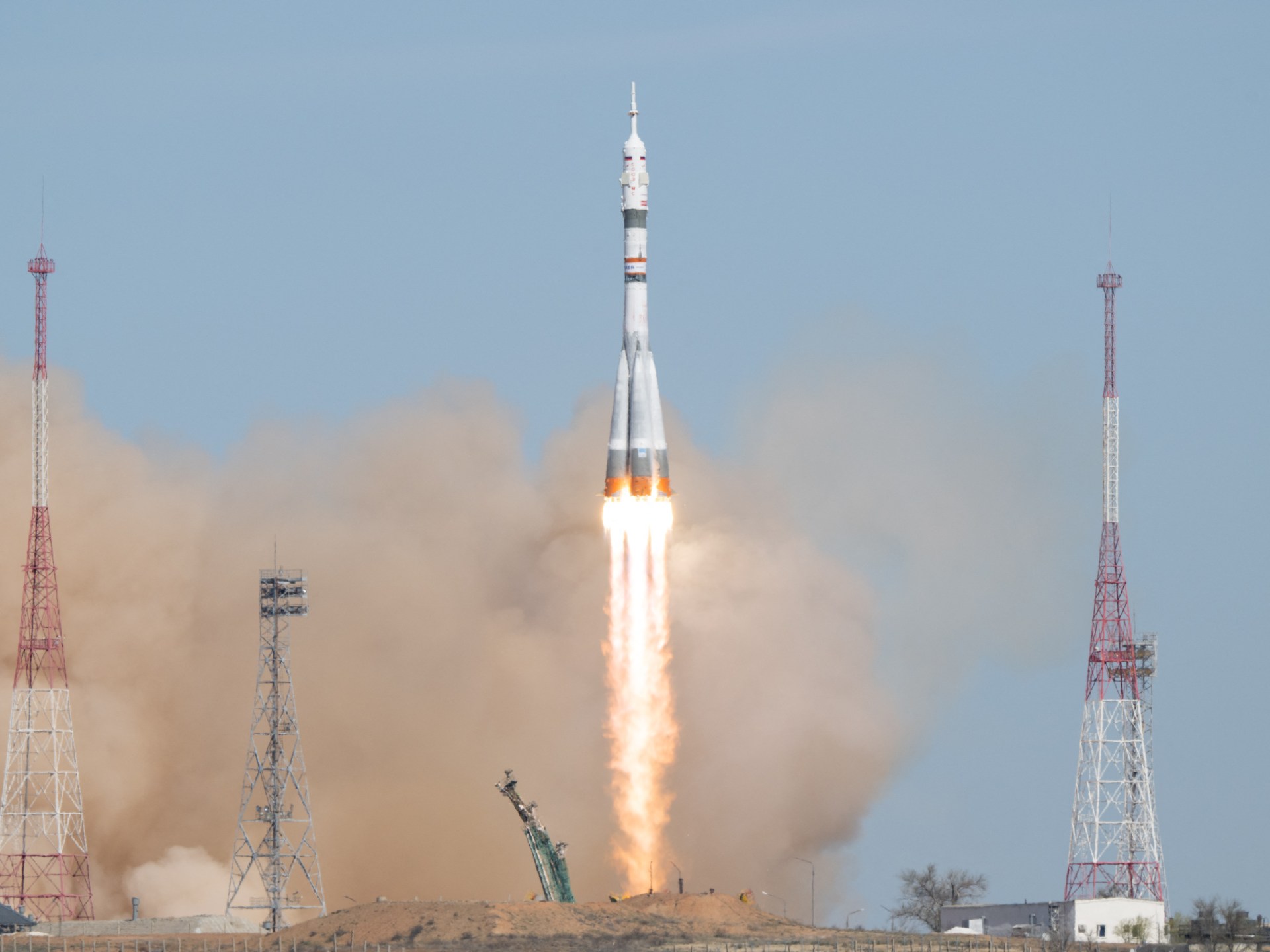 Russian and US crew blasts off in Soyuz rocket bound for ISS