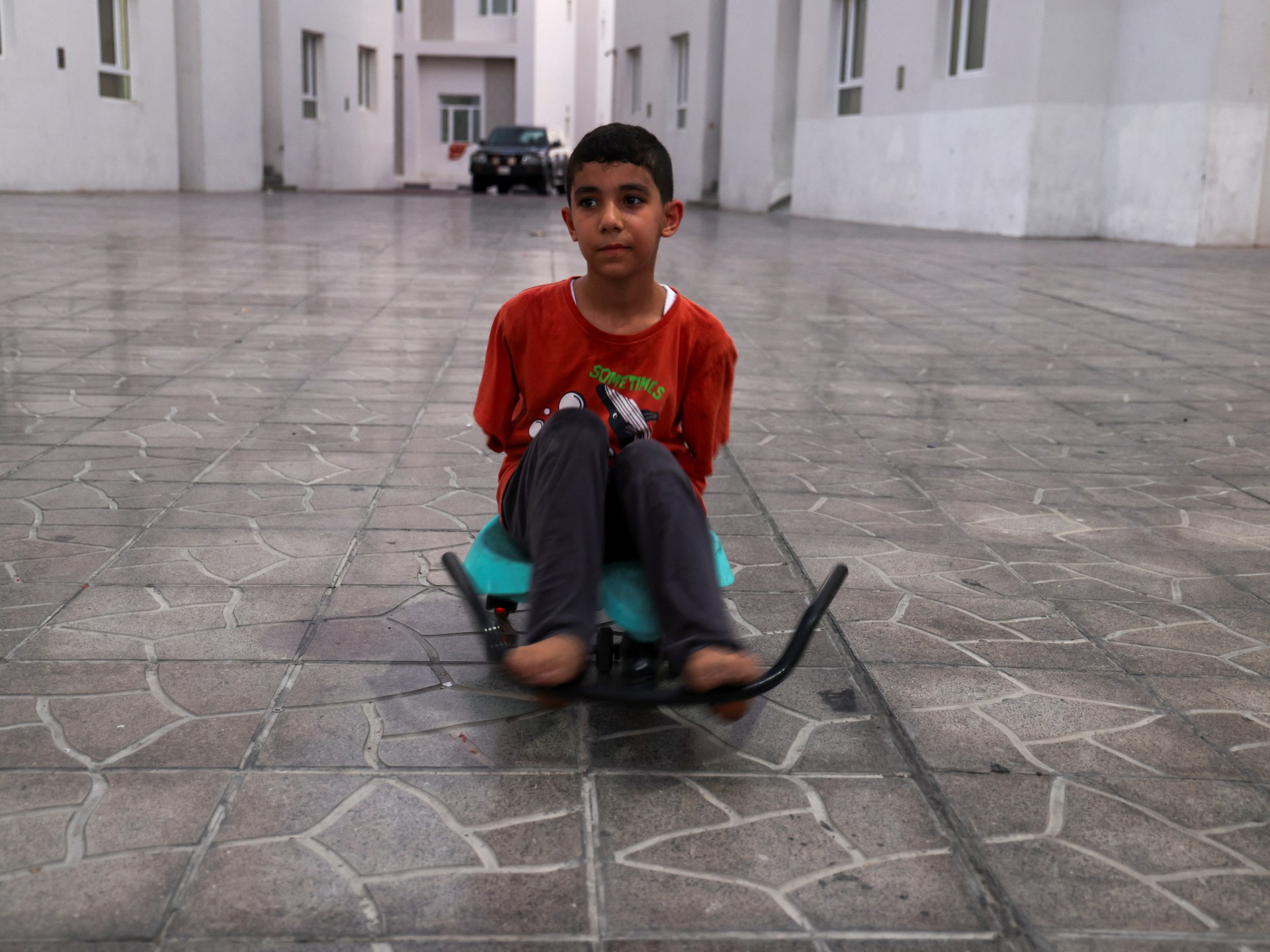 ‘How do I live like this?’ asks Gaza boy who lost arms in Israeli attack