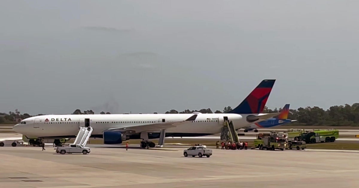 Delta plane catches fire at Orlando airport, passengers evacuate on slides