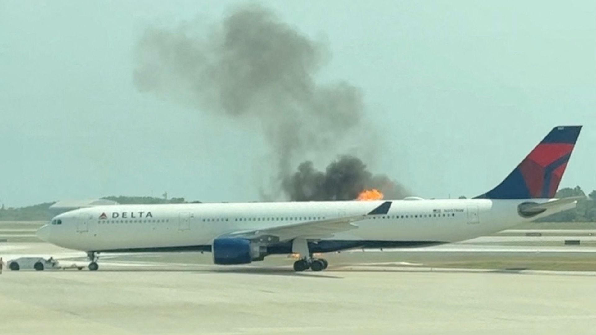 Hundreds of passengers evacuated after plane engine catches fire