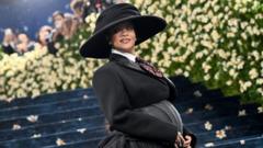 Rihanna reveals she is pregnant with third child at Met Gala