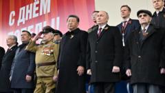 China’s Xi stands with Putin at Russia’s Victory Day parade