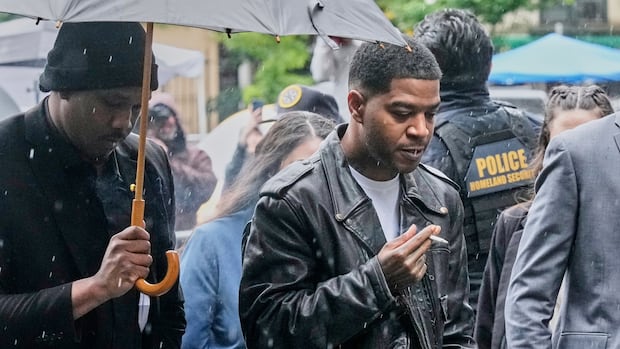 Rapper Kid Cudi says his car was set on fire weeks after Sean (Diddy) Combs broke into his home
