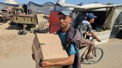 Controversial US-backed group says it has begun aid distribution in Gaza