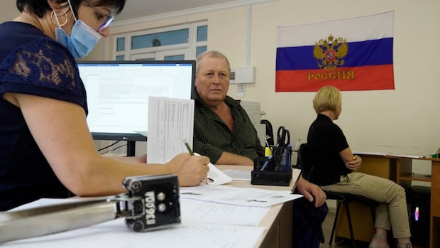 Russia tells Ukrainians in occupied areas to get Russian passport or leave