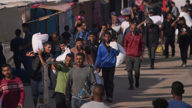 Israeli attack near aid delivery point kills at least 31 in Gaza, local health officials say