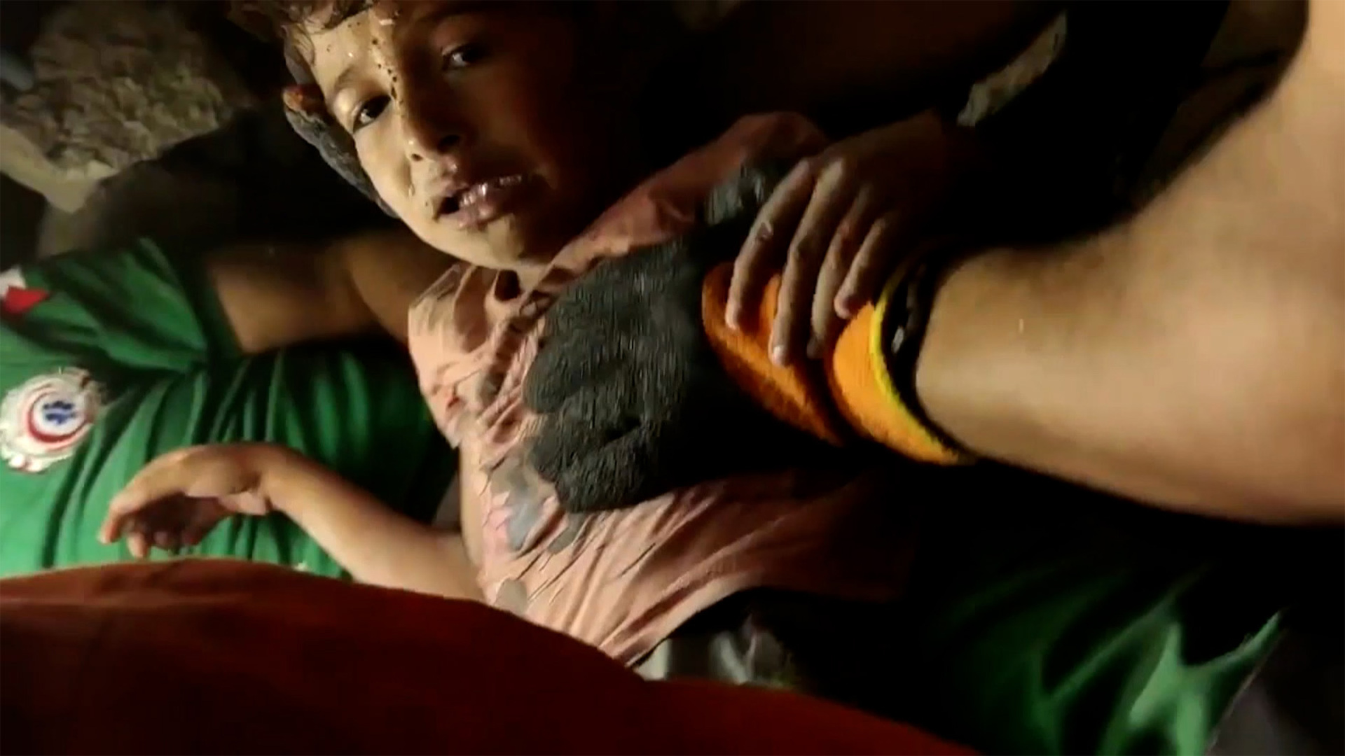 Boy and baby brother pulled alive from rubble after Israeli strike