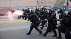 Riot police and protesters clash after LA immigration raids