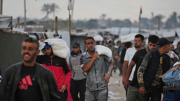 Israeli gunfire kills over a dozen Palestinians near Gaza aid site, health officials say