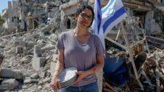 ‘It’s heavy on the heart’: Israelis survey damage in city hit by Iranian missile