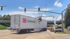 US electrical worker left dangling after being hit by truck