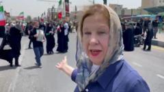 Watch: Anger and uncertainty in Iran as crowds mourn dead