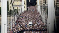 Budapest Pride draws huge crowds in defiance of Orban legal threats