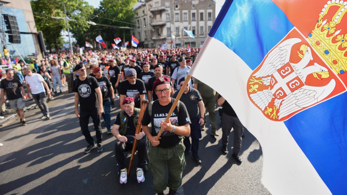 Serbian protesters rally in Belgrade to demand snap election