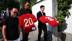 Footballers and family lay flowers at funeral of Diogo Jota and André Silva