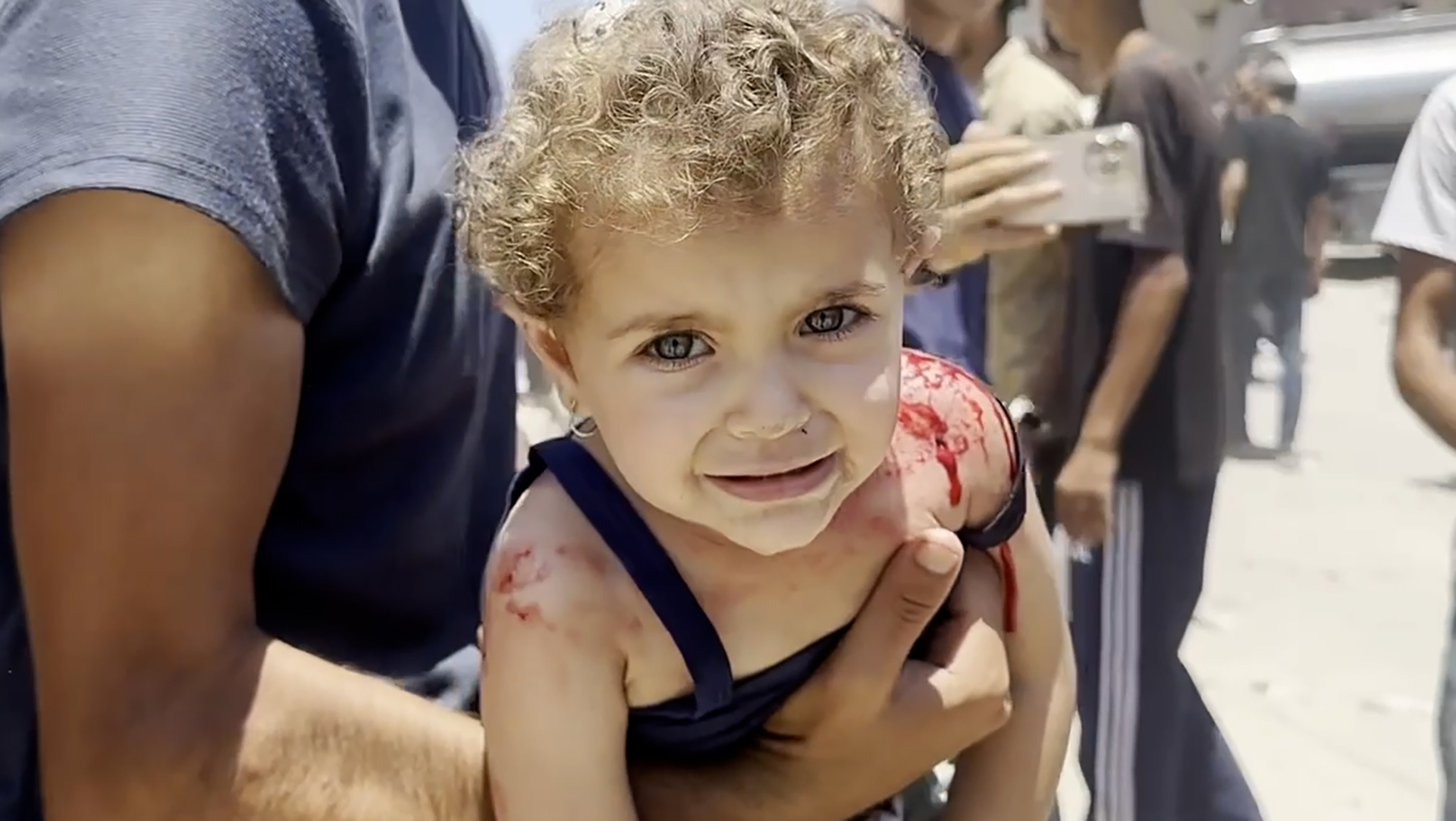 Bloodied children rushed from Gaza tent camp reportedly hit by shelling