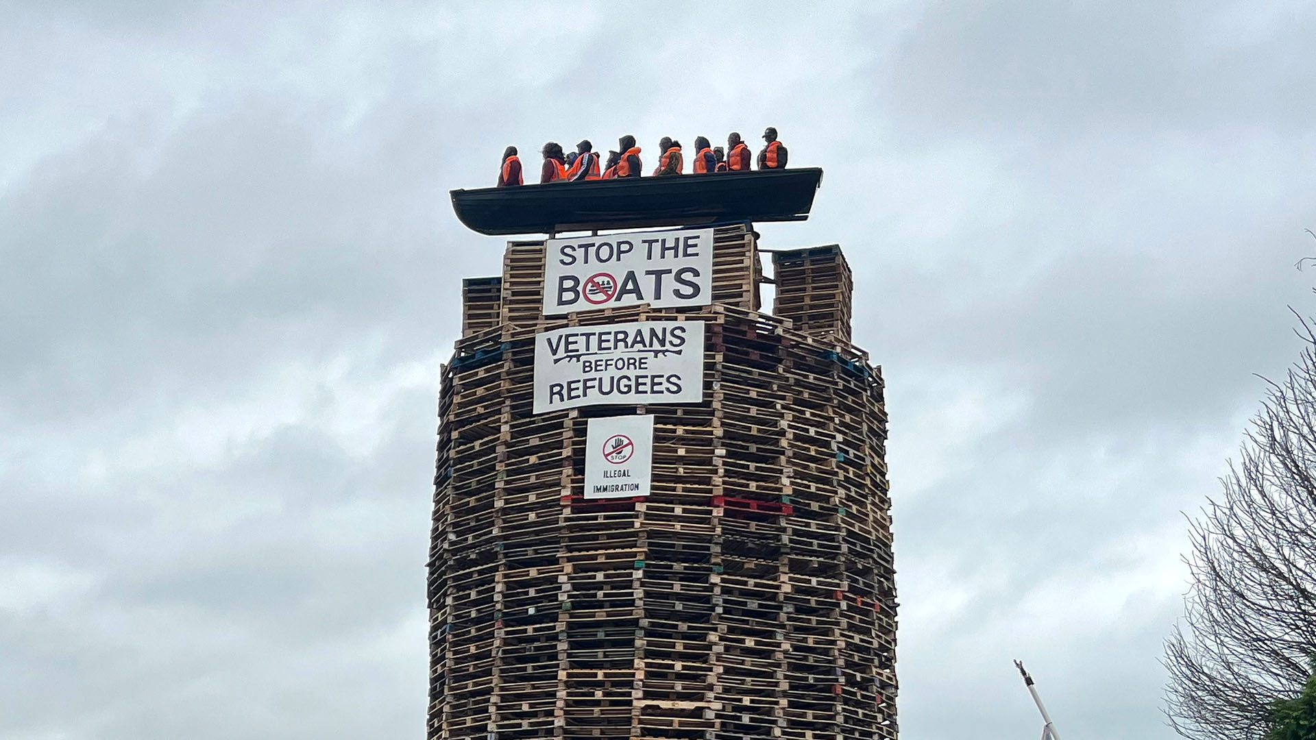 Bonfire effigy of migrant vessel widely condemned in Northern Ireland