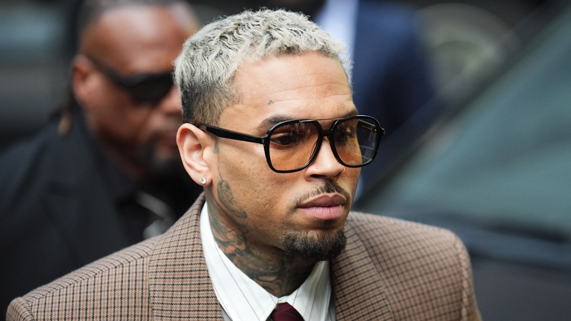 Singer Chris Brown denies further charges following alleged bottle attack