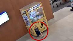 Watch: Moment child gets stuck inside a claw machine