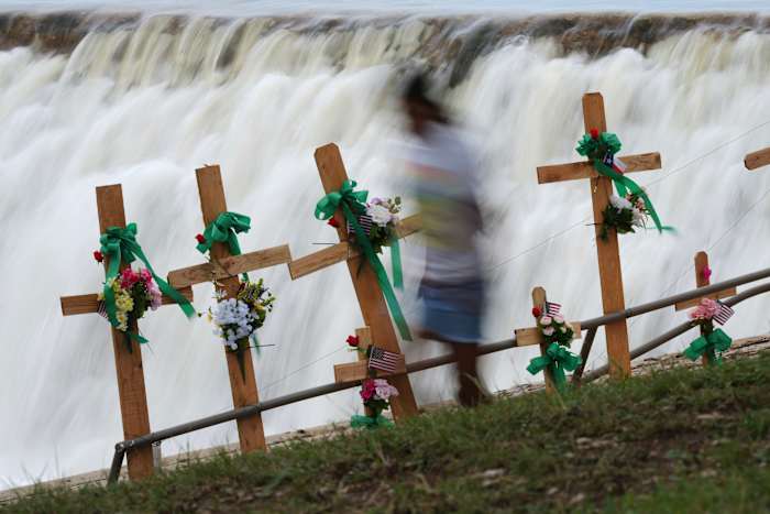 Search for Texas flood victims to resume after pause due to heavy rains