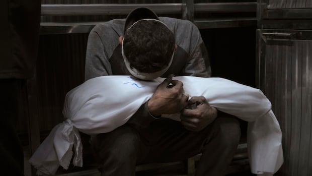 Israeli strike in Gaza kills 19 members of a family, health officials say