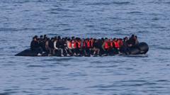 Germany to tighten people-smuggling law as chancellor visits UK