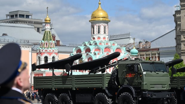 Russia touts strike drones made in factory on TV, where teens appear to be working on them