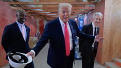 Watch: Trump jokes he wants Powell to lower interest rates in awkward exchange