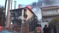 Firefighters battle to contain Greek wildfires
