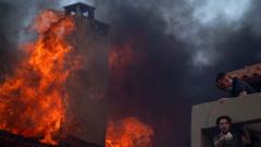 Wildfires rage in Greece as extreme heat persists