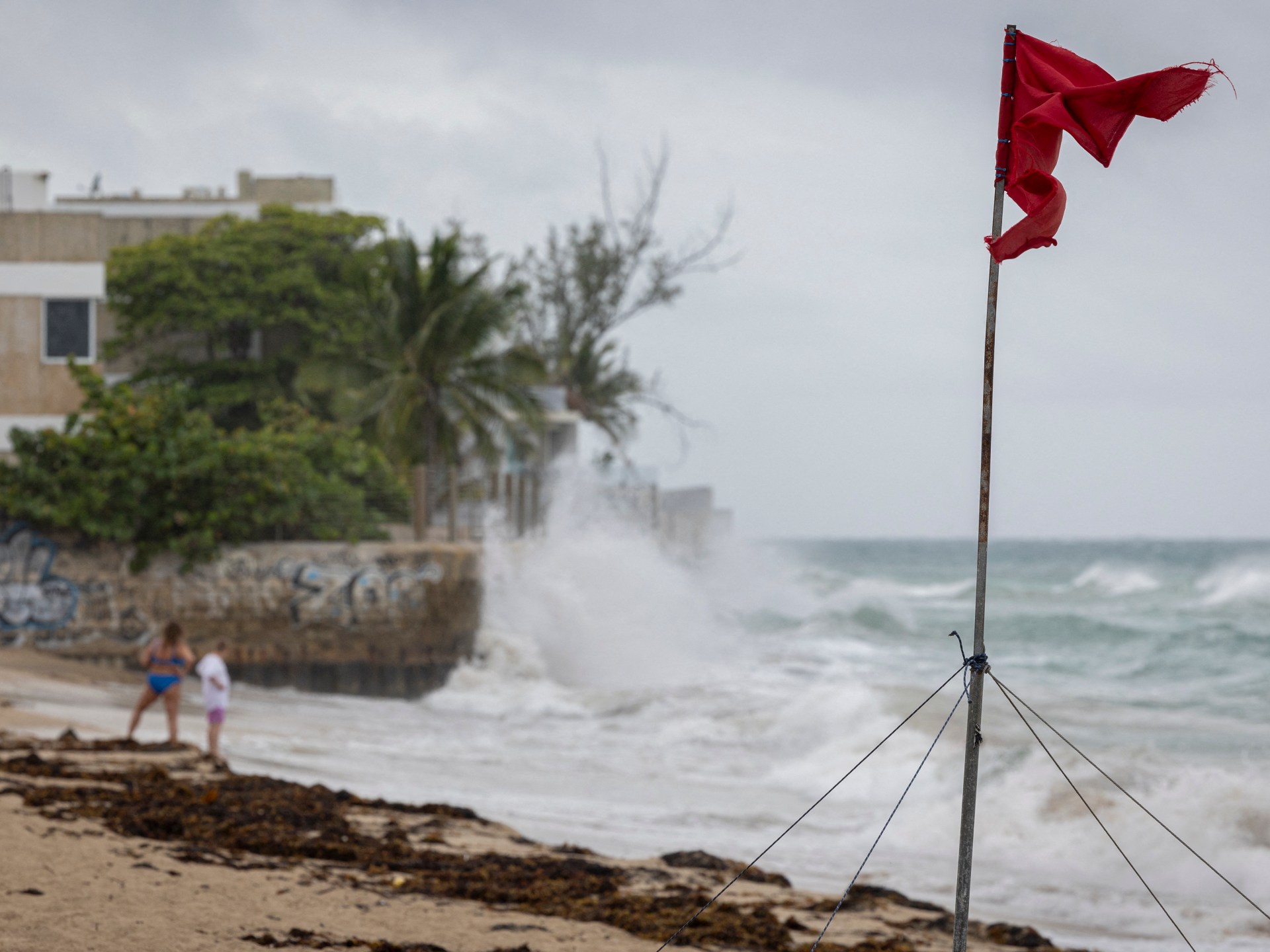 Erin downgraded to Category 3 hurricane, NHC says