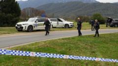 Manhunt under way after two police shot dead in rural Australian town