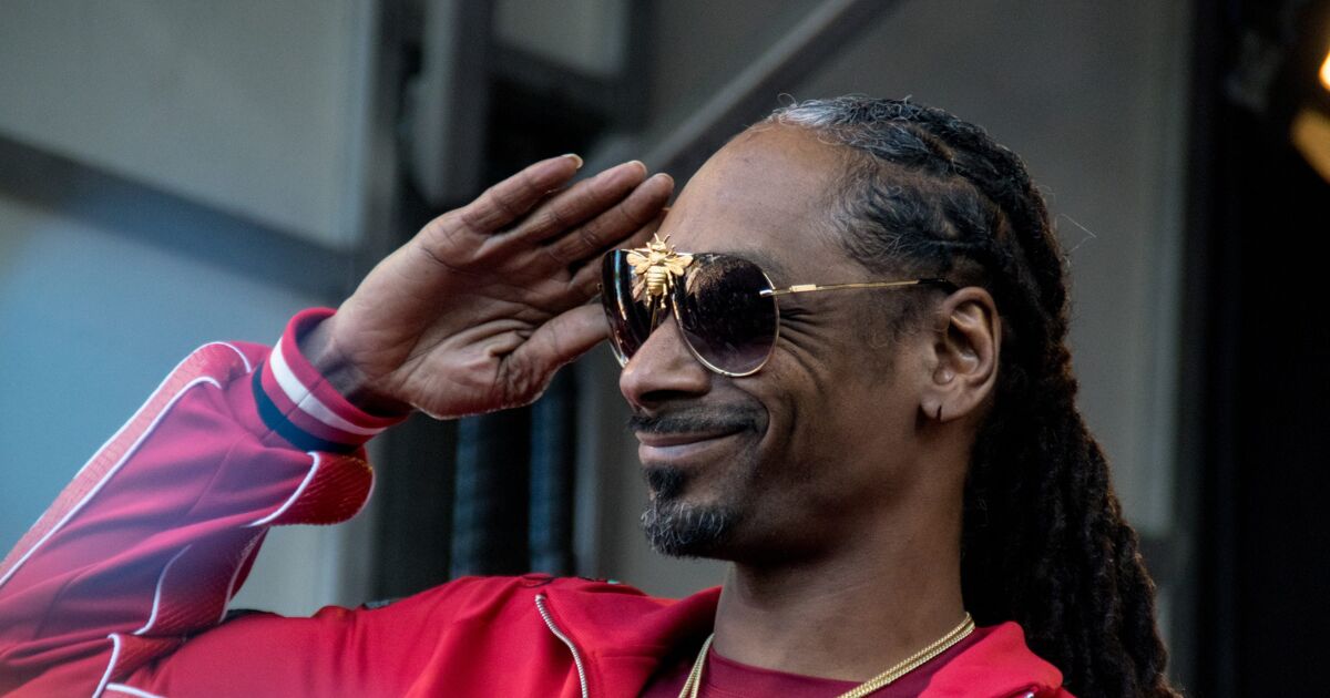 Creator of Lightyear’s same-sex couple says Snoop Dogg “sucks”: “To infinity. Love is love.”
