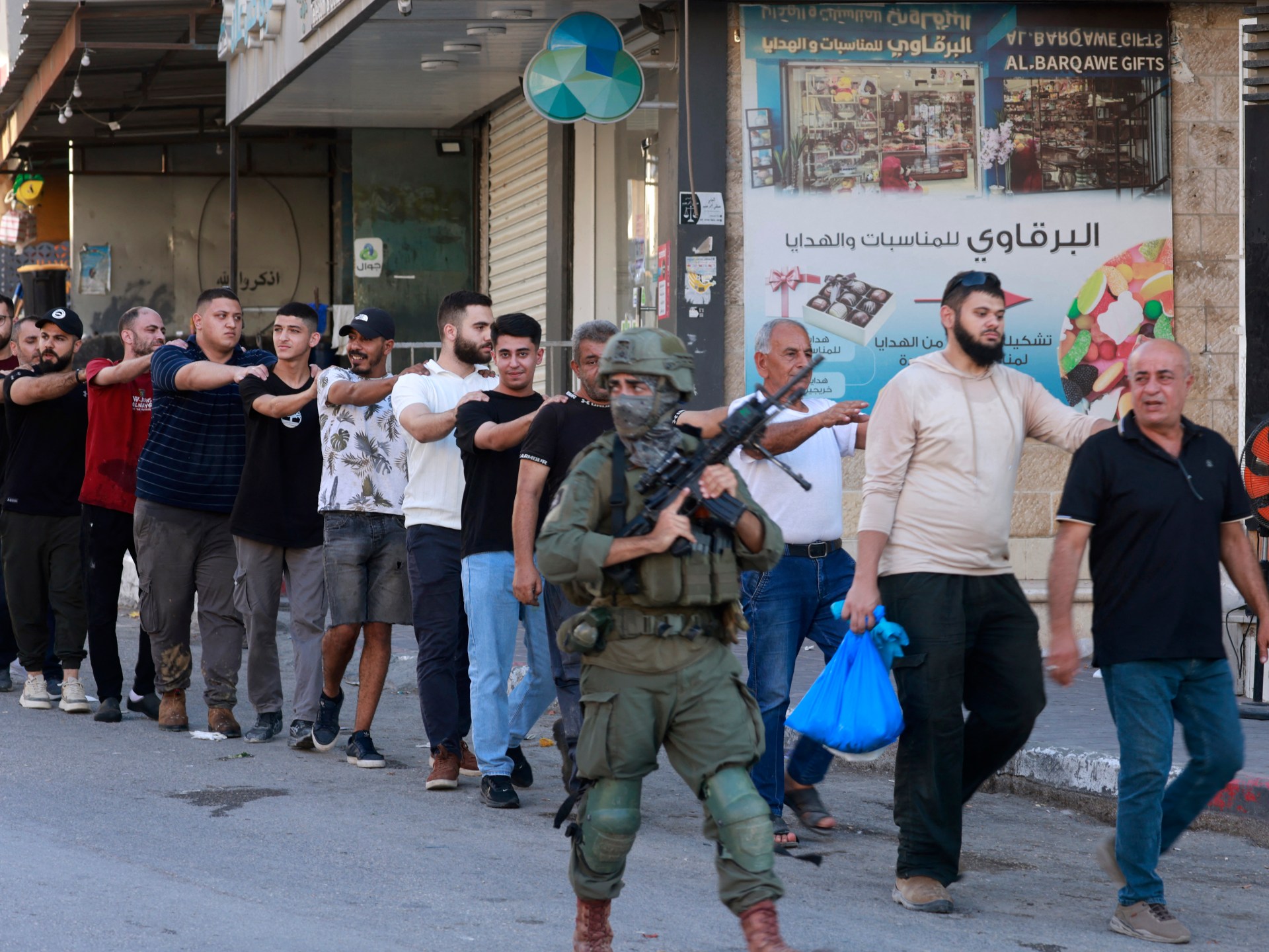 Israeli forces arrest over 100 Palestinians, impose curfew in West Bank