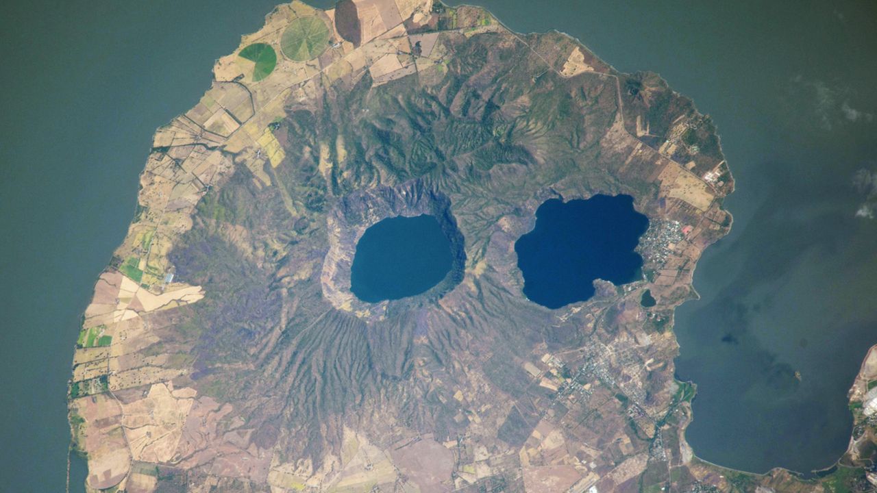 Volcanic ‘googly eyes’ stare into space from skull-like peninsula — Earth from space