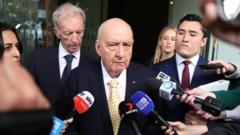 Sex abuse charges against top Australian radio host downgraded