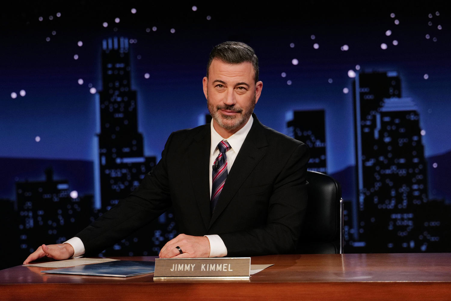 Jimmy Kimmel seeks to smooth tensions and takes aim at Trump in first show since ABC suspension