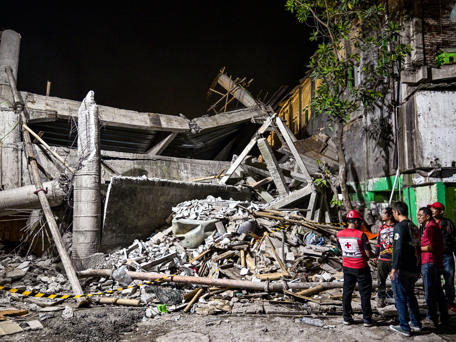 Dozens trapped in deadly Indonesia school collapse
