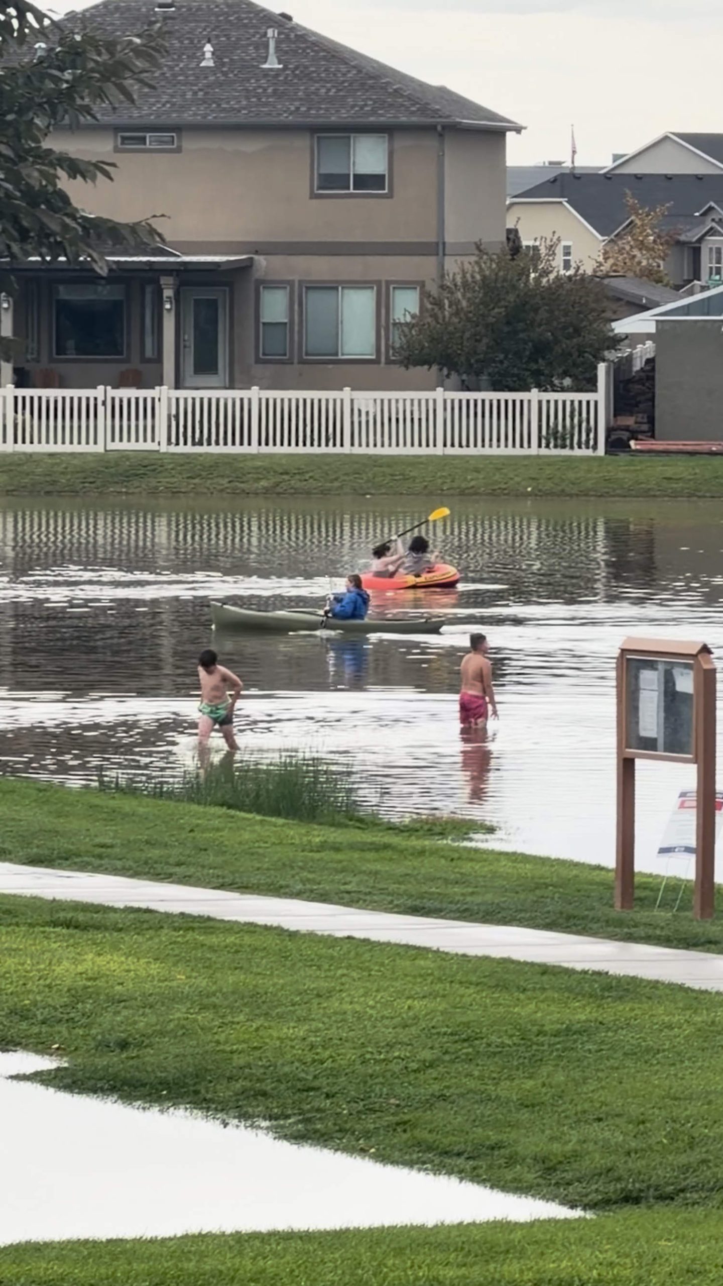 Several people canoe in flooded Utah streets