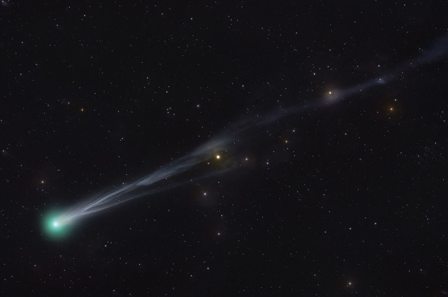 Two greenish comets are streaking across the night sky this month