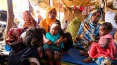 Drone strike in besieged Sudan city kills at least 60 people