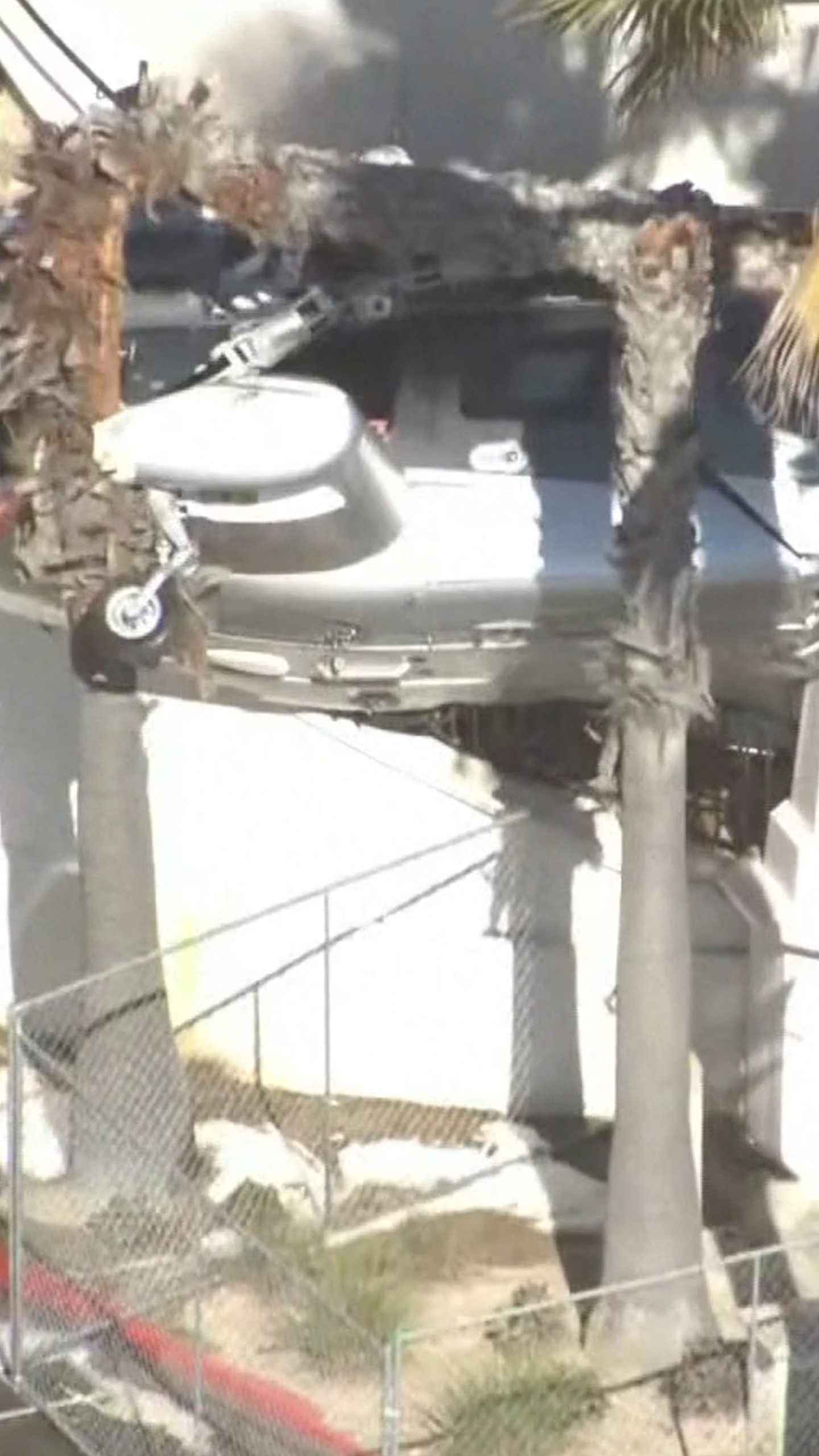 Helicopter crashes into California building