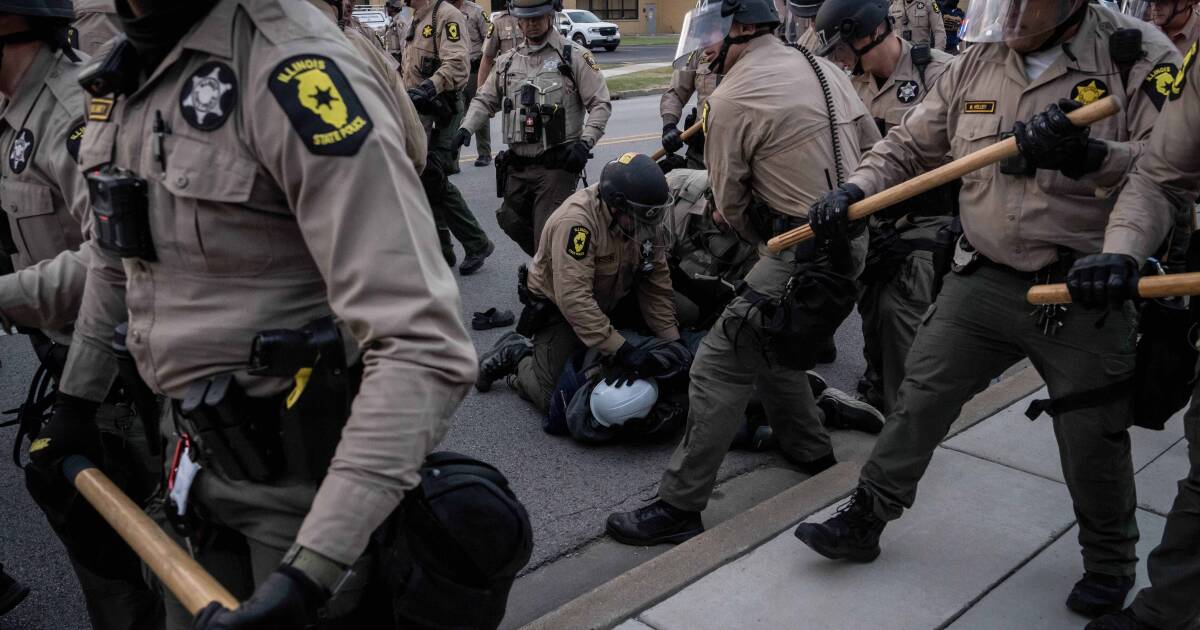 Protesters clash with police outside Chicago as court allows National Guard troops to stay
