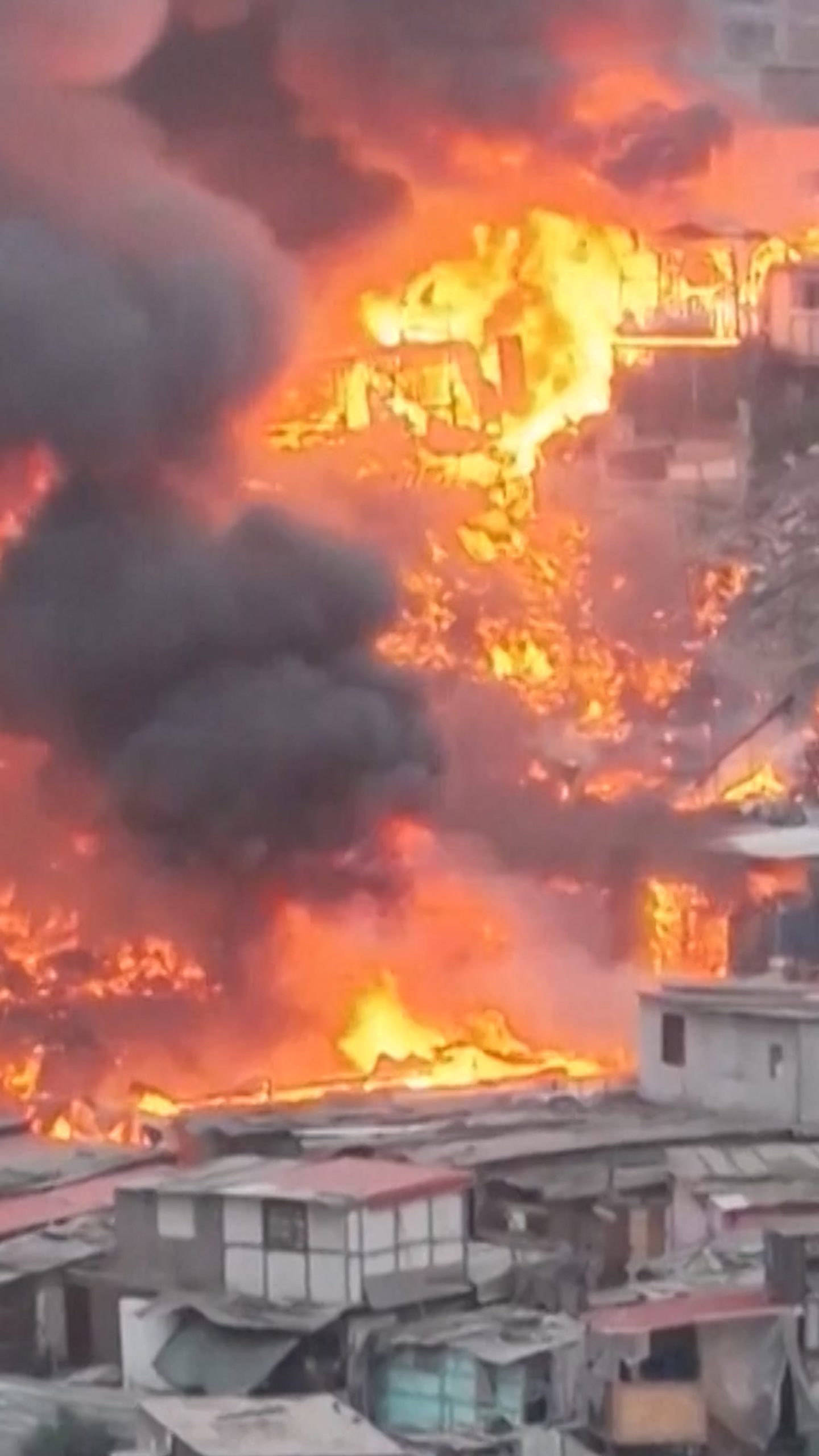 Drone footage shows massive fire engulfing Peru homes