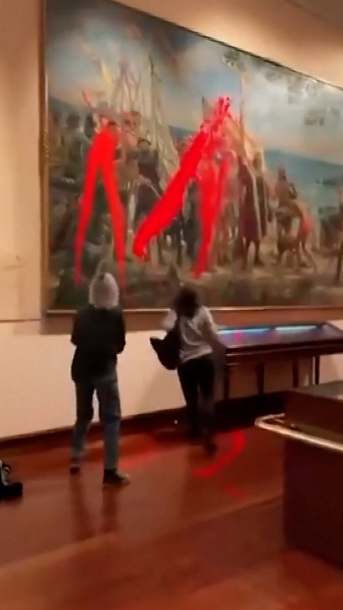 Climate activists vandalize Columbus painting in Madrid