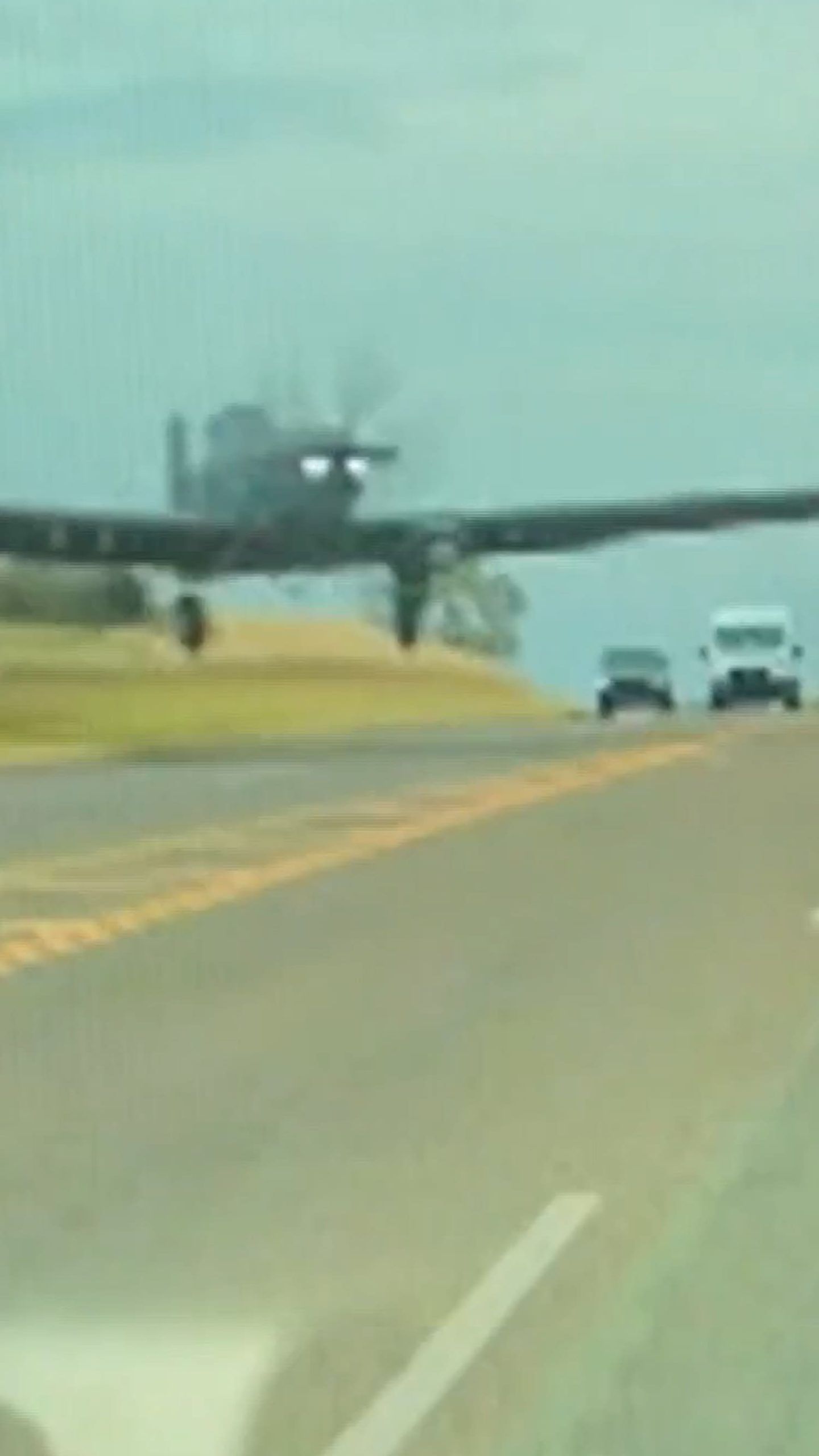 Dashcam video shows plane fly low on road