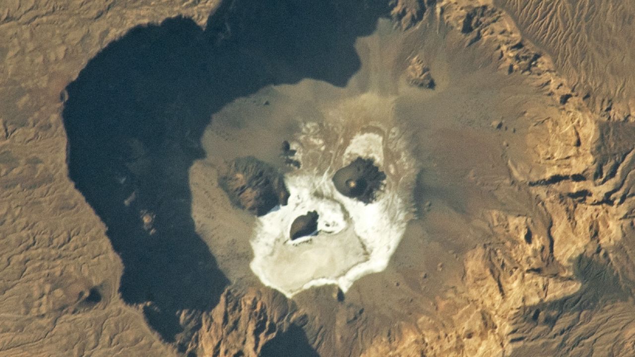 Glowering ‘skull’ stares upward from a giant volcanic pit in the Sahara — Earth from space