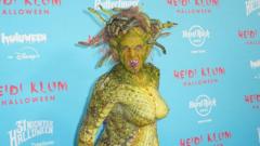 Watch: Heidi Klum slithers into Halloween as Medusa