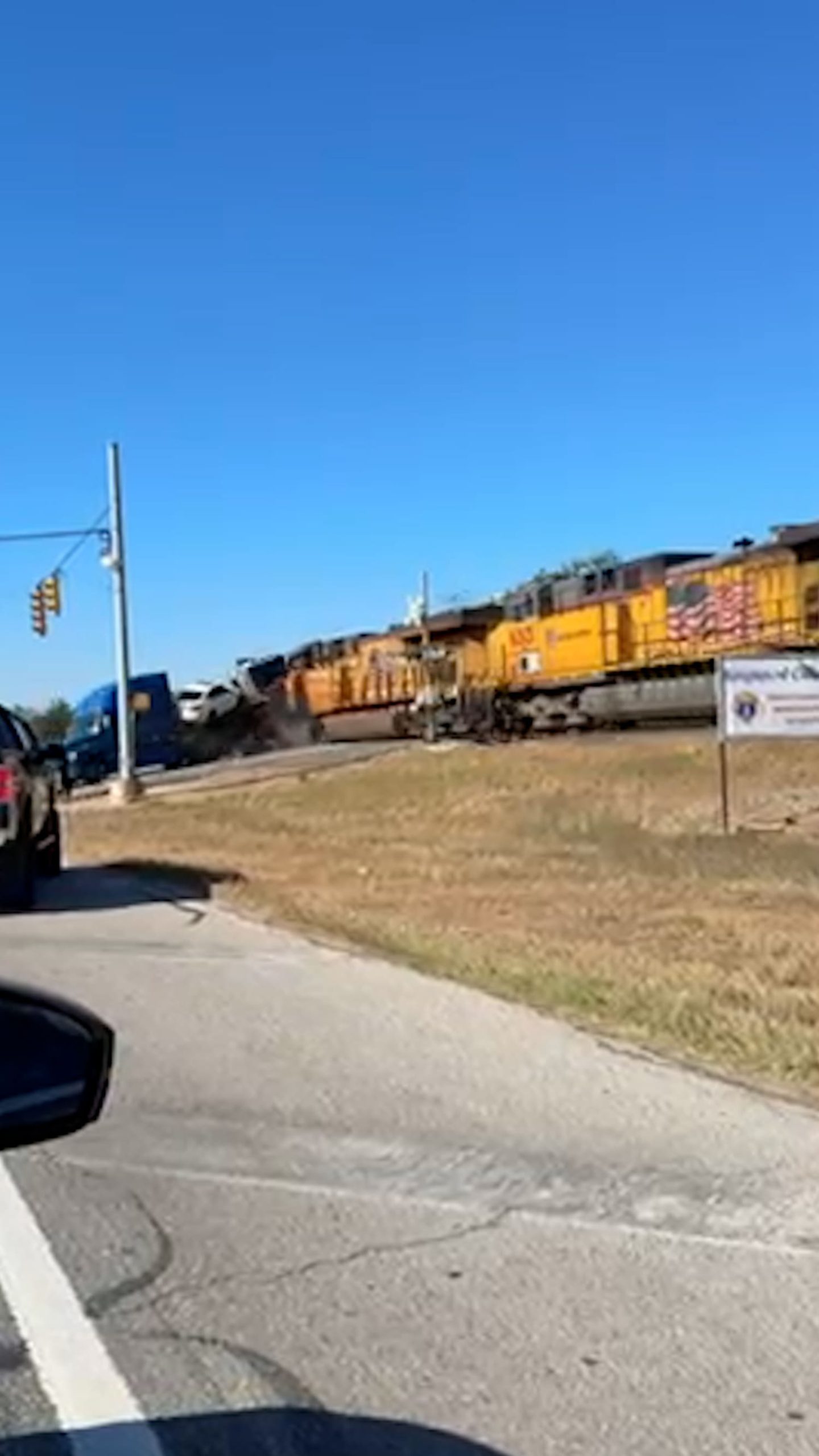 Train collides with truck hauling cars in Texas