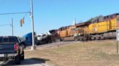 Watch: Moment train collides with lorry carrying vehicles